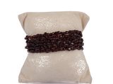 a close up of a pillow on a white surface with a pillow