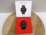 the watch is in the box on the table next to the box