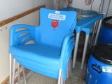 a blue chair and a blue table in a room