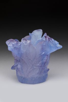 purple glass vase filled with ice crystals on a white surface