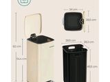 une poubelle blanche et noire à côté d'une poubelle noire et blanche
