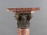 an image of a close up of a column with a marble top