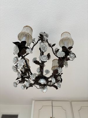a chandelier hanging from the ceiling in a kitchen