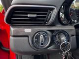 a close up of a car ' s dashboard with a key in it