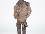 an old wooden statue of a man with a beard and a hat