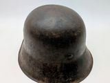 a helmet that is sitting on a white surface
