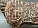 a statue of a cow with a pattern on it ' s body