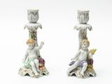 two figurines that are sitting next to each other