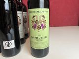 three bottles of wine sitting on a table
