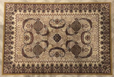 a close up of a rug on a bed with a white background