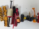 many different types of toy vehicles on a white surface