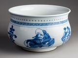 a blue and white bowl with a picture of a man on it