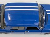a blue car that is sitting on a white surface