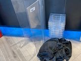 a pile of plastic items on the floor next to a wall