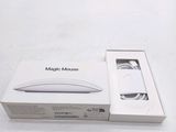 a white box with a mouse in it on a table