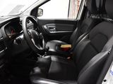 the interior of a car with black leather seats and steering controls