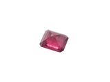 a close up of a pink diamond on a white background