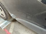 a close up of a car that has been painted black