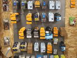 a display of cell phones on a pegboard in a store