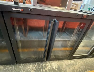 two glass doors that are open in a store