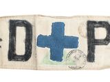 une photo d'un ancien panneau sur lequel figure une croix bleue