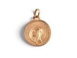 a close up of a gold medal on a white background