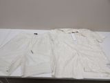 the white sweater and shorts are on the table ready to be worn