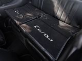 a car seat with two trays on it in the back of a car