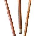 three wooden pencils sitting next to each other on top of a white surface