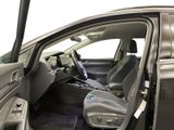the interior of a car with the door open and the driver ' s seat down