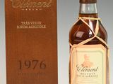 a bottle of whisky sitting next to a wooden box