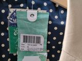 a label on a coat hanger on a hanger