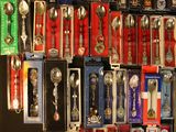 a lot of spoons and spoon spoons that are on display