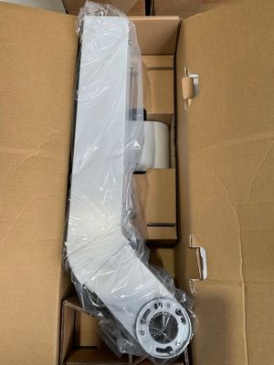 une boîte en carton contenant un objet blanc
