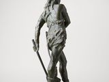 a bronze statue of a man with a spear and a staff
