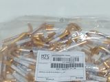 a bag of gold screws on a white table