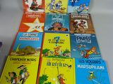 plusieurs livres pour enfants sont alignés sur une table