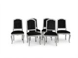 lot de quatre chaises avec des assises rembourrées en velours noir