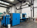 a blue machine that is sitting in a building