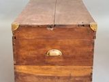 a small wooden box with a handle on it