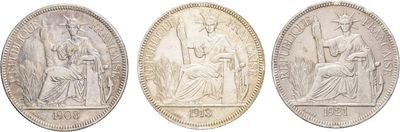 three silver coins with the image of jesus and mary on them