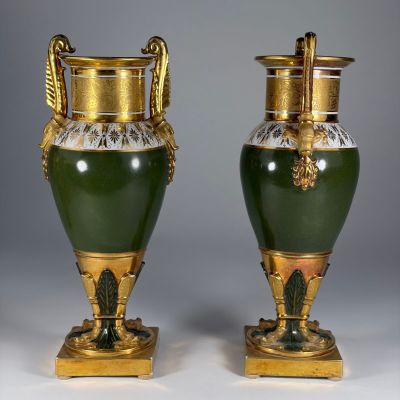 pair of green and gold vases with handles and handles