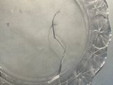 a glass plate with a crack in the middle of it