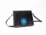 black and blue handbag with a blue eye on the front