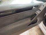 a car door with the door handle open and the door handle down