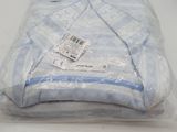 a plastic bag with a blue and white shirt inside of it