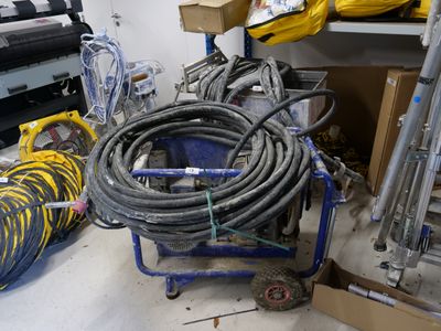 a picture of a room that has a bunch of hoses on the floor