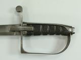 a close up of a sword on a white surface
