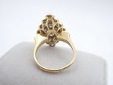 an image of a gold ring with diamonds on it