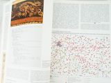 an open book with a picture of a map on it